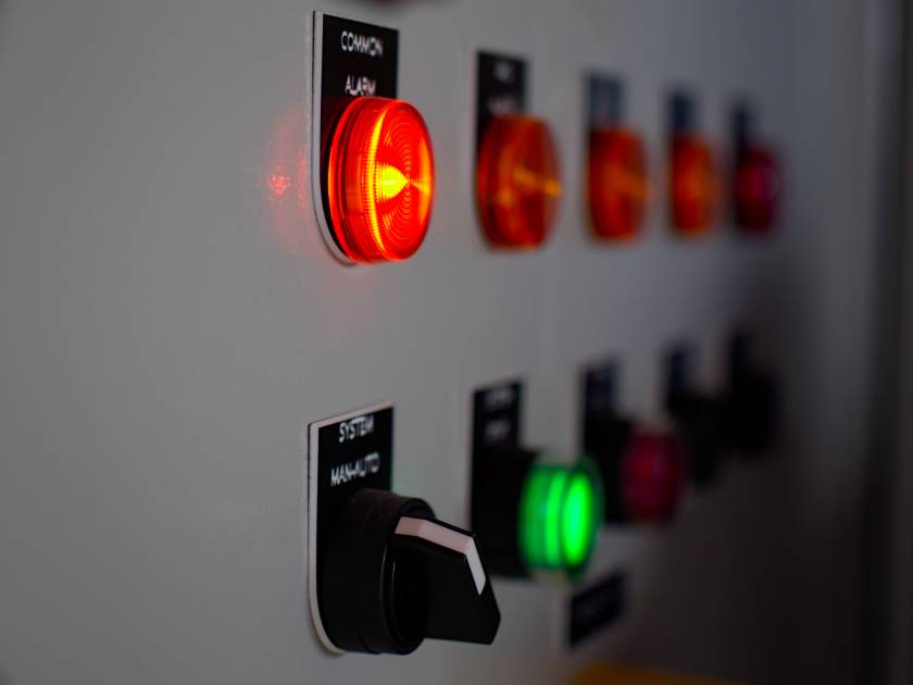 Selective focus of a power panel with red and green lights