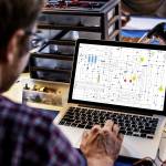 Computer laptop showing electronic circuit pattern