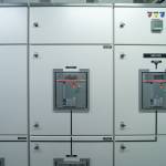 Interior of electrical room. Power energy motor machinery cabinets in control or server room, main operator station network and circuit center in industry factory manufacturing system. generator