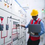 professional technician engineer with safety helmet hard hat working in industrial manufacturing