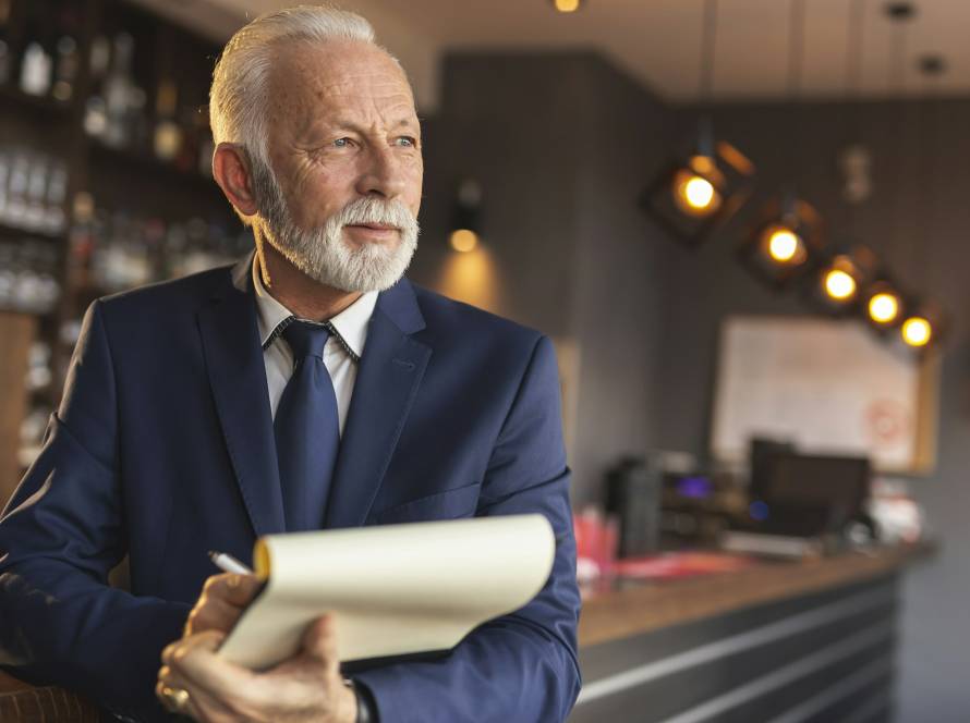 Restaurant manager signing contracts